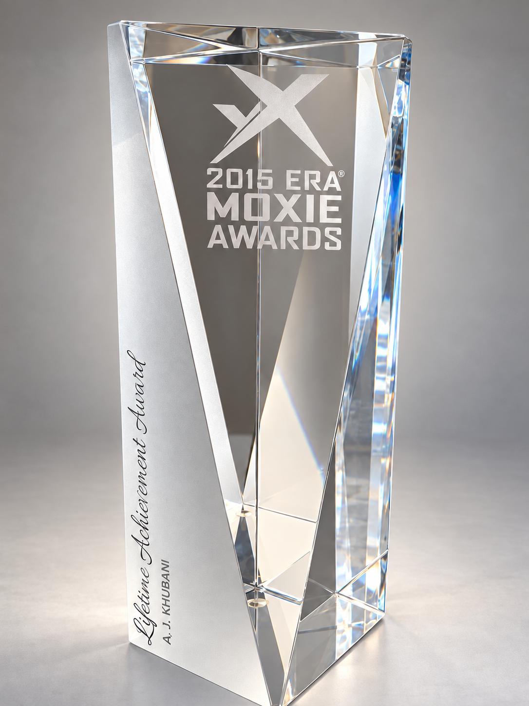 Crystal 2015 ERA Moxie Lifetime Achievement Award engraved with A. J. Khubani’s name